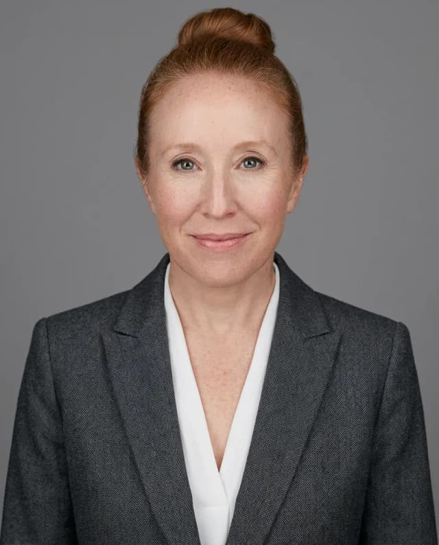 AI Corporate Headshot of a 50 woman by ExecHeadshots