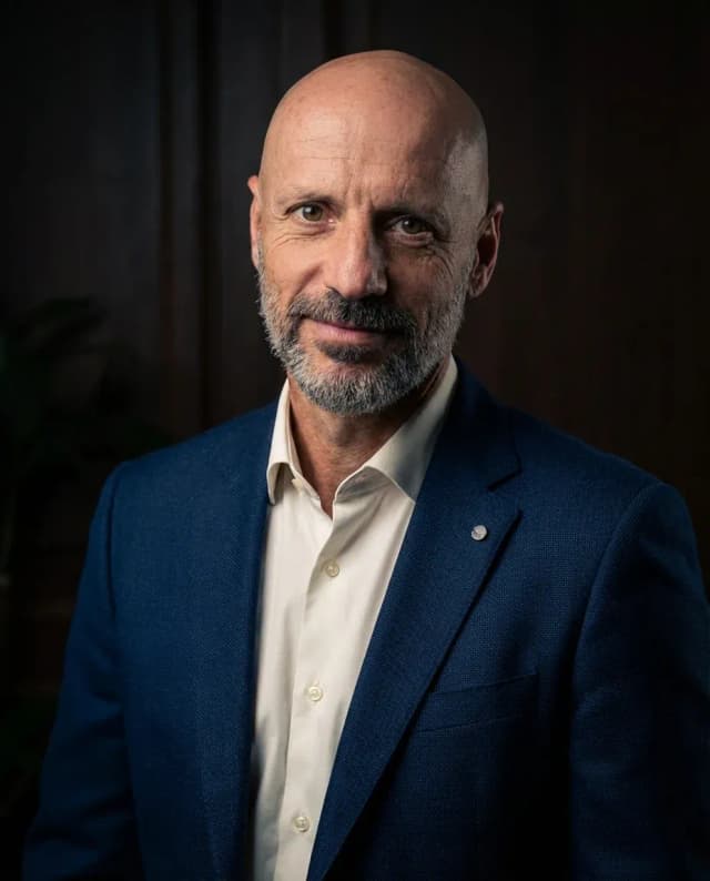 AI Corporate Headshot of a 55 man by ExecHeadshots