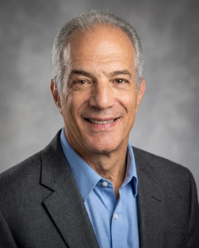 AI Dentist Headshot of a 60 man by ExecHeadshots