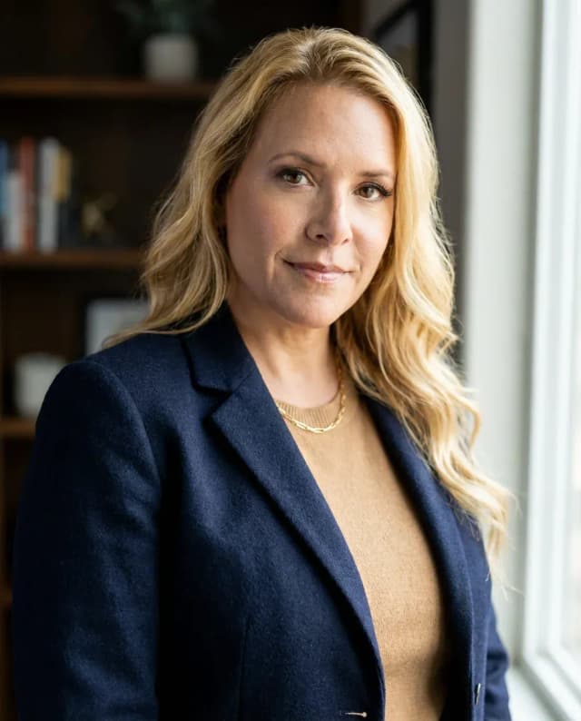 AI Director Headshot of a 45 woman by ExecHeadshots