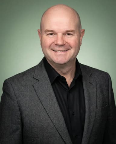 AI Financial Advisor Headshot of a 50 man by ExecHeadshots