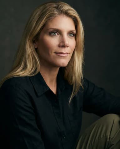 AI Graphic Designer Headshot of a 45 woman by ExecHeadshots