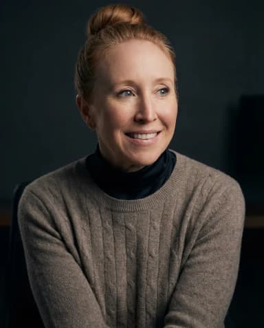 AI Graphic Designer Headshot of a 45 woman by ExecHeadshots