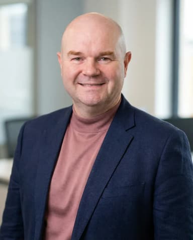 AI Graphic Designer Headshot of a 50 man by ExecHeadshots