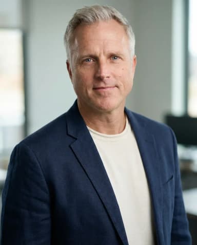 AI Graphic Designer Headshot of a 55 man by ExecHeadshots