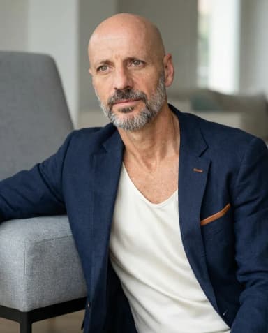 AI Interior Designer Headshot of a 55 man by ExecHeadshots