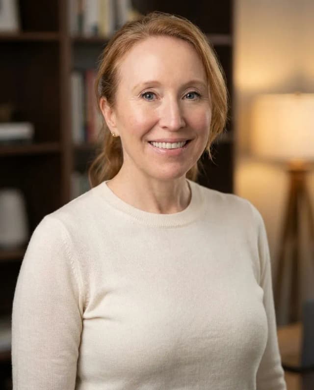 AI Web Developer Headshot of a 50 woman by ExecHeadshots