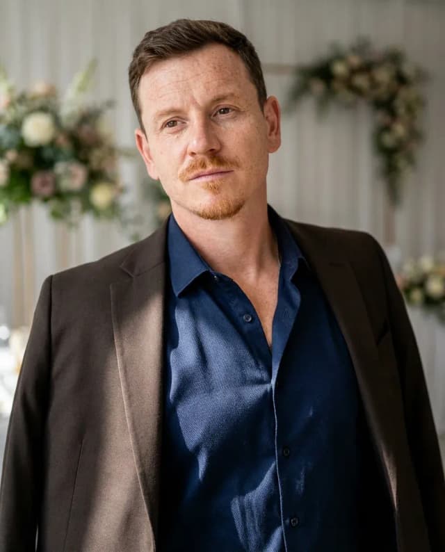 AI Wedding Planner Headshot of a 40 man by ExecHeadshots