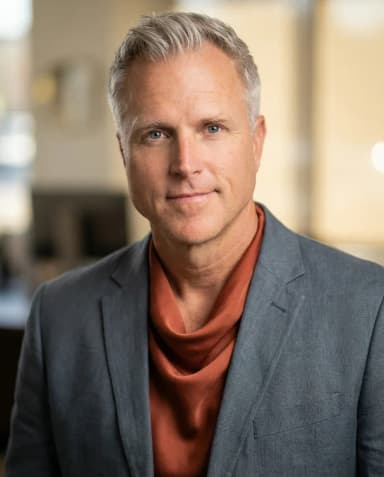 AI Wedding Planner Headshot of a 55 man by ExecHeadshots