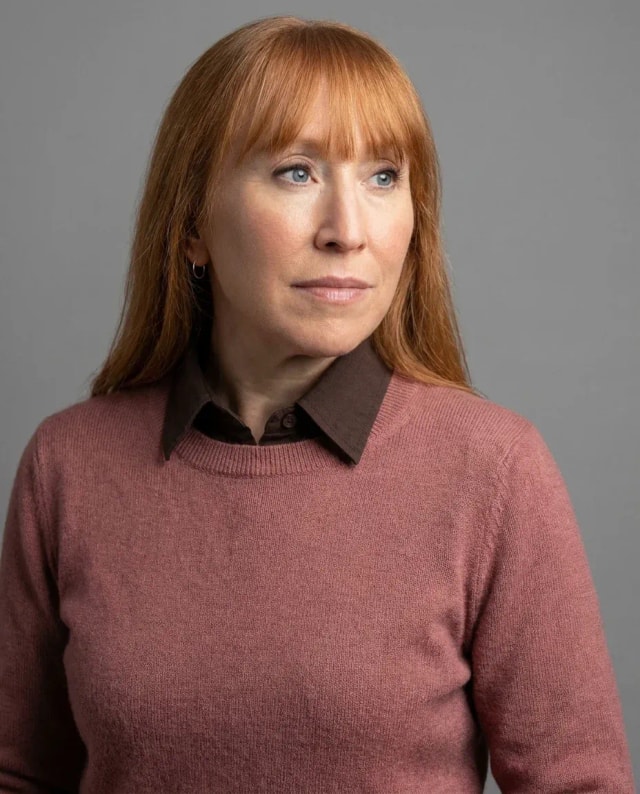 AI Architect Headshot of a 50 woman by ExecHeadshots