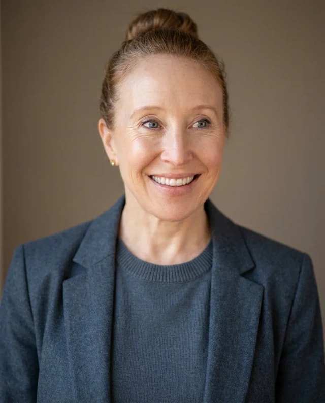 AI Engineer Headshot of a 50 woman by ExecHeadshots