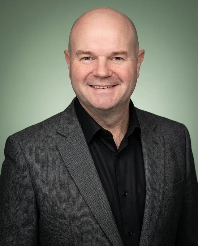 AI Financial Advisor Headshot of a 50 man by ExecHeadshots