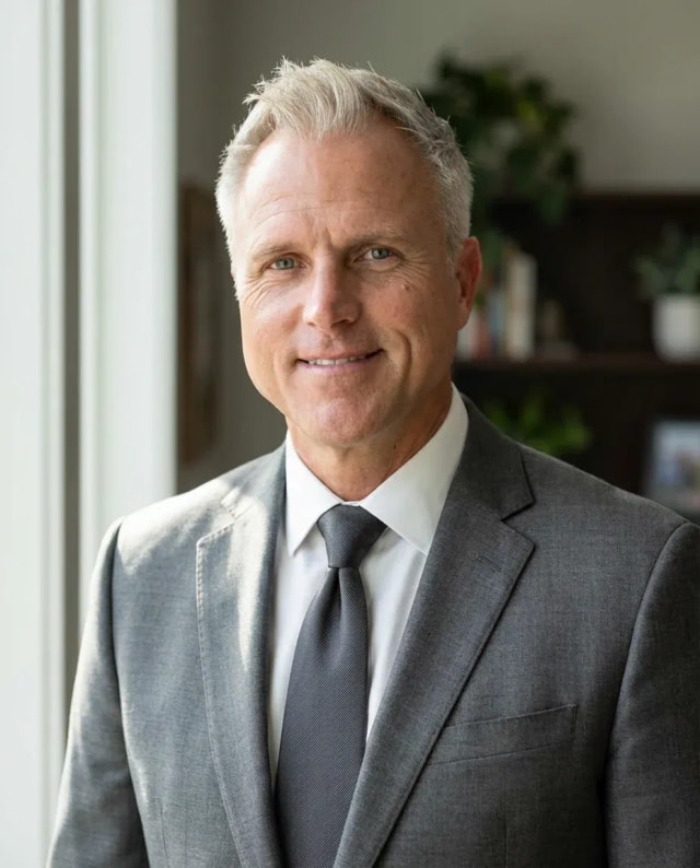 AI Financial Advisor Headshot of a 55 man by ExecHeadshots