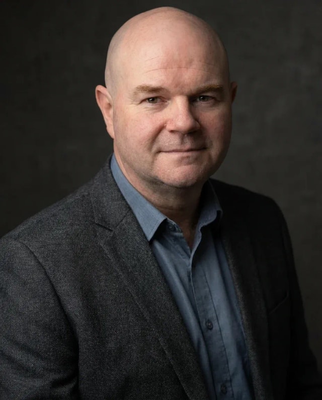 AI Insurance Agent Headshot of a 50 man by ExecHeadshots