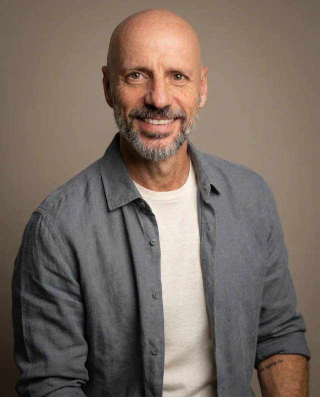 AI Writer Headshot of a 55 man by ExecHeadshots