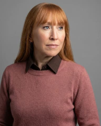 AI Architect Headshot of a 50 woman by ExecHeadshots