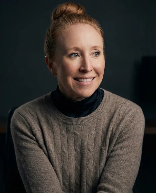 AI Graphic Designer Headshot of a 45 woman by ExecHeadshots