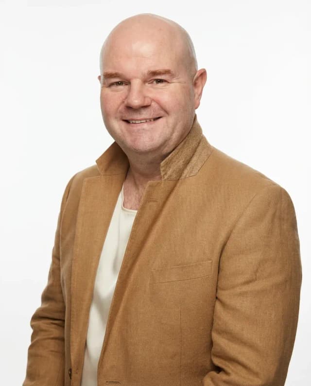 AI Makeup Artist Headshot of a 50 man by ExecHeadshots