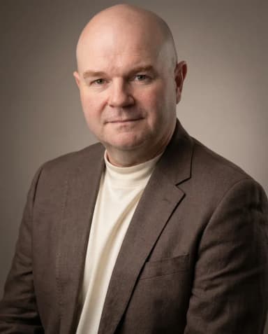 AI Writer Headshot of a 50 man by ExecHeadshots